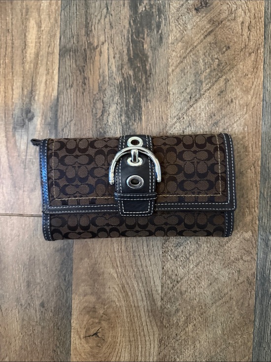 Coach Handbags - Coach Brown Signature Canvas Wallet with Silver Buckle.